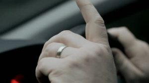 stock-footage-hands-drumming-on-steering-wheel